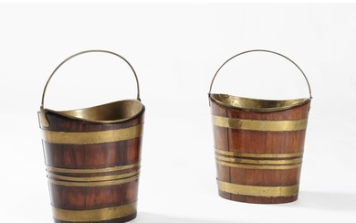Two similar mahogany and brass bound kettle stands or buckets