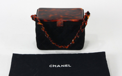 Chanel patent hardcase cosmetic box, having a tortoise shell finished top, above the quilted body, with strap, opening to a labeled...