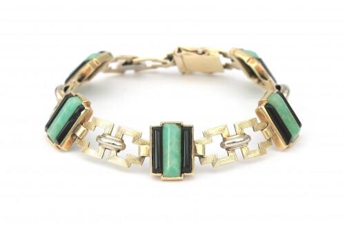 A 14 karat gold Art Deco bracelet with amazonite and onyx. Composed of rectangular links, alternated with amazonite and onyx set links. Gross weight: 18 g.
