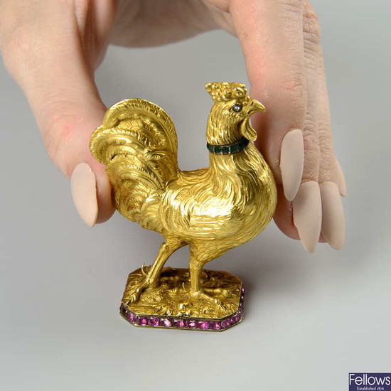A 19th century 18ct gold cockerel/rooster figurine, with detachable head, diamond eyes, emerald collar and ruby trim.