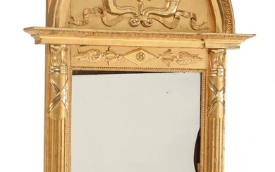 A 19th century Empire gilded and bronzed wood mirror. H. 184. B....