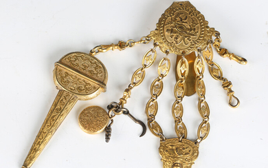 A 19th century French gilt metal châtelaine, the cartouche clip suspended with six chains, one