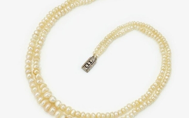 A 2-strand natural pearl necklace with a decorative