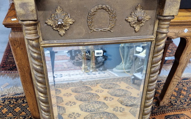 A BEVELLED GLASS RECTANGULAR MIRROR IN A REGENCY GILT FRAME, THE SIDES WITH SPIRAL TWIST COLUMNS