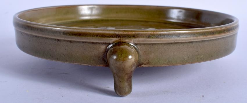 A CHINESE THREE LEGGED POTTERY CENSER. 17 cm wide.