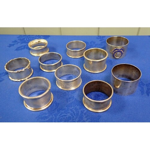 A COLLECTION OF MASONIC SILVER NAPKIN RINGS including an ena...
