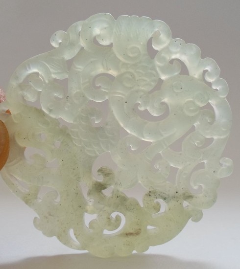A Chinese Jade Carved Pendant With Dragon And Phoenix