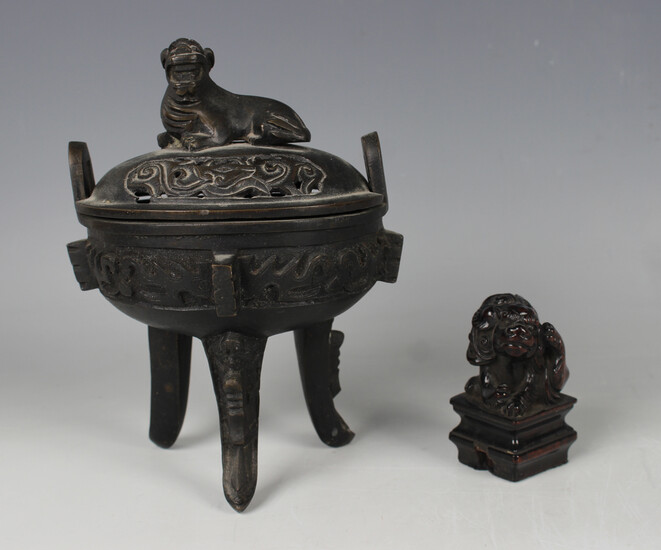 A Chinese dark brown patinated bronze oval censer and cover, late Qing dynasty, the pierced and dome