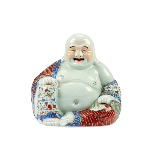 A Chinese polychrome porcelain figure of a seated laughing b...