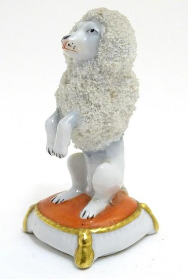 A Continental model of a seated begging poodle dog.