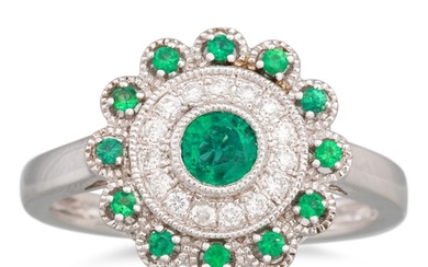 A DIAMOND AND EMERALD CLUSTER RING, the circular emerald to ...
