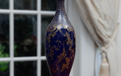 A Doulton Burslem cobalt blue tall bud vase with gilt floral decoration, Height 30cm