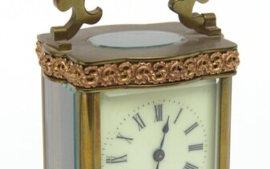 A FRENCH BRASS CASED CARRIAGE CLOCK WITH KEY, THE MOVEMENT WITH RETAIL MARK 'H&H' FOR HARRIS AND HARRINGTON, THE UPPER AND LOWER SEC.
