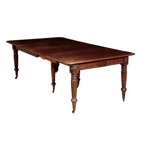 A GEORGE IV MAHOGANY EXTENDING DINING TABLE of rectangular f...