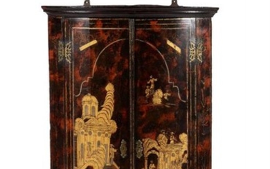 A George I simulated tortoiseshell and gilt chinoiserie decorated bowfront hanging corner cupboard, circa 1720