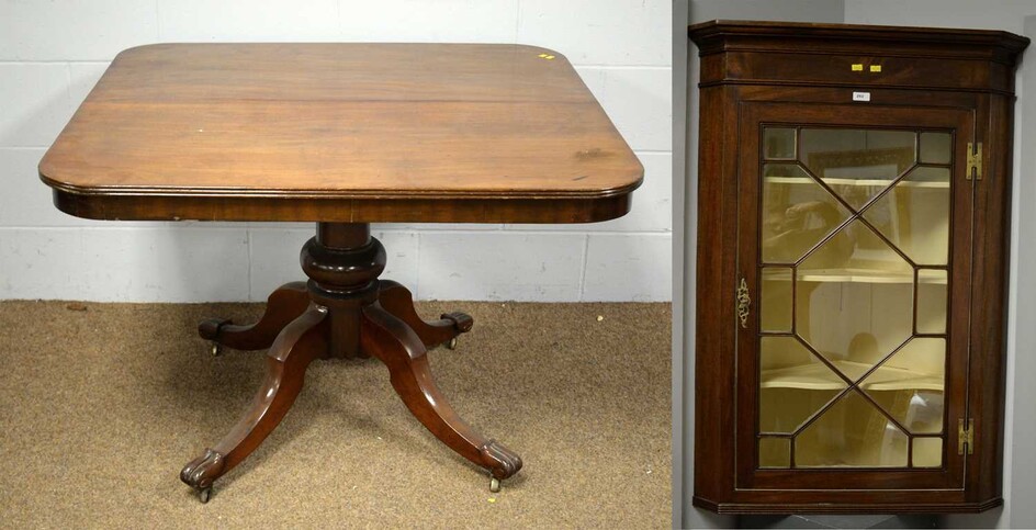 A Georgian style mahogany corner cupboard and a Victorian mahogany breakfast table