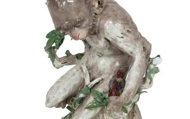 A German Porcelain Figure of a Monkey Height 12 x width