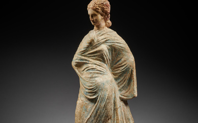 A Greek terracotta female figure, Tanagra, Hellenistic period, circa 3rd century B.C.