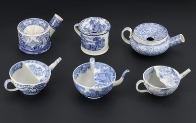 A Group of Blue and White Earthenware Spittoons and Feeding Cups