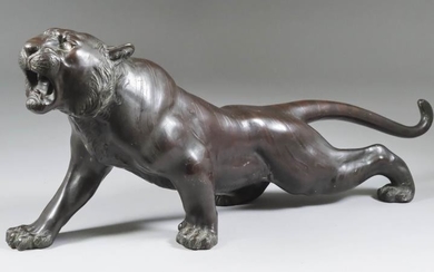 A Japanese Brown Patinated Bronze Figure of a Tiger,...