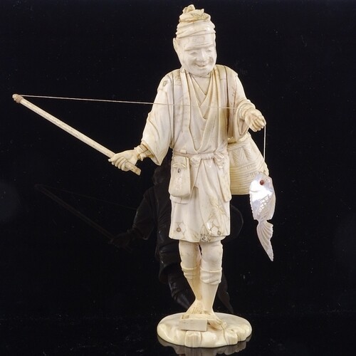 A Japanese ivory okimono depicting a fisherman with a mother...