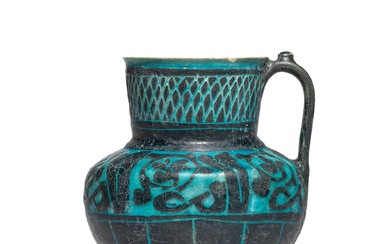 A Kashan turquoise-glazed silhouette-ware jug, Persia, 12th/13th century