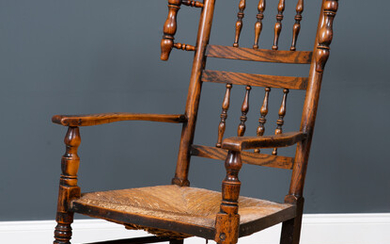 A Lancashire elm spindle back rocking chair