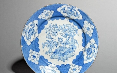 A Liverpool delftware plate c.1760, painted in blue...