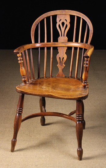 A Low Back Yew-wood Windsor Armchair having a burr-figured back hoop and bow. The pierced upper & lo