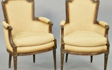A Matched Pair of Louis XVI Walnut Bergeres, late 18th
