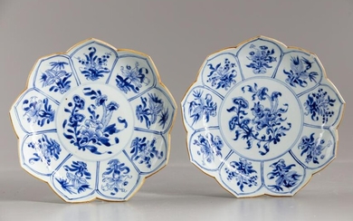 A PAIR OF CHINESE BLUE AND WHITE LOTUS-SHAPED DISHES