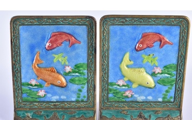 A PAIR OF EARLY 20TH CENTURY CHINESE ENAMELLED FISH BOOKENDS...