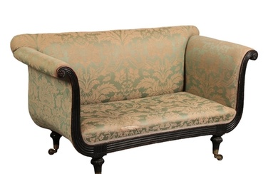 A REGENCY MAHOGANY SOFA covered in green damask, with strai...