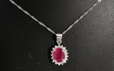A RUBY AND DIAMOND PENDANT IN 18CT GOLD