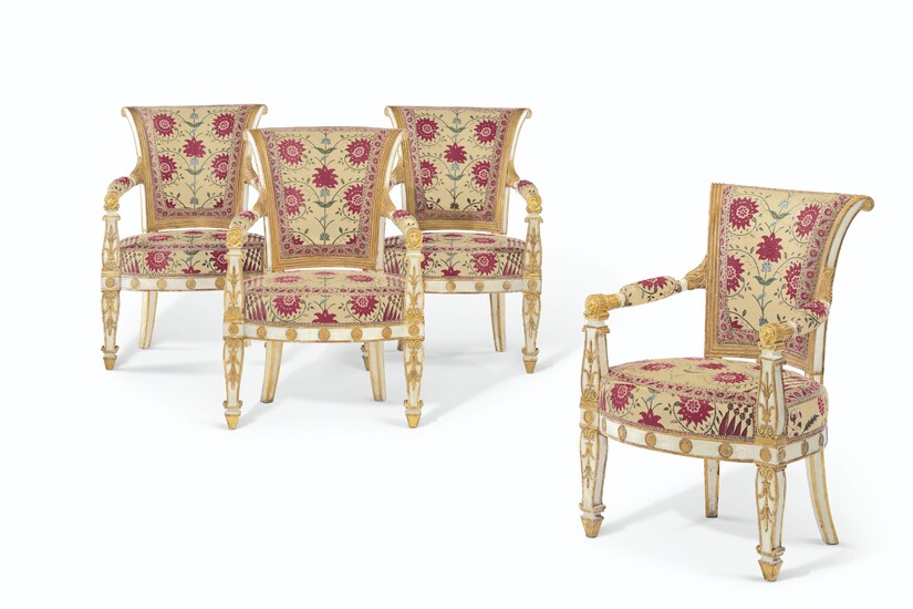 A SET OF FOUR EMPIRE WHITE-PAINTED AND PARCEL-GILT FAUTEUILS, CIRCA 1810, THE UPHOLSTERY SUPPLIED BY RENZO MONGIARDINO