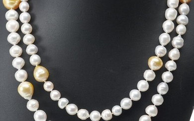 A STRAND OF BAROQUE SOUTH SEA PEARLS GRADUATING IN SIZE FROM 8.5MM TO 15.5MM AND VARYING IN COLOUR AND SET AT INTERVALS WITH GOLDEN...