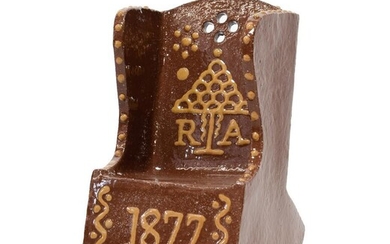 A Slipware Rocking Chair, dated 1877, in the form of...