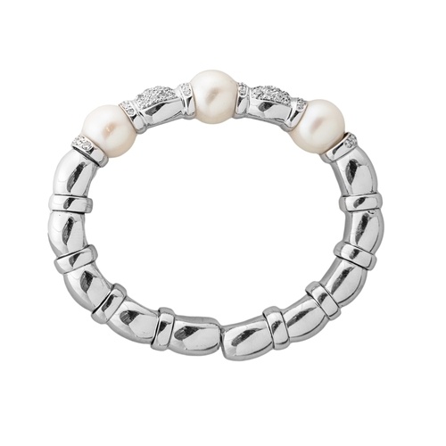A Tahitian pearl and brilliant cut diamond bangle Set to the...