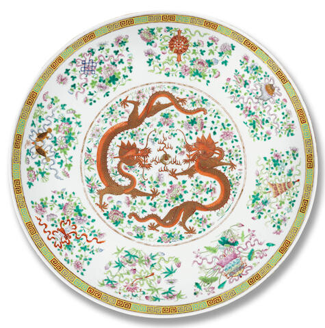 A VERY LARGE AND RARE FAMILLE ROSE 'DRAGON AND PHOENIX' SAUCER-DISH