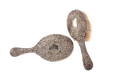 A VICTORIAN SILVER-BACKED HAIRBRUSH AND HAND MIRROR