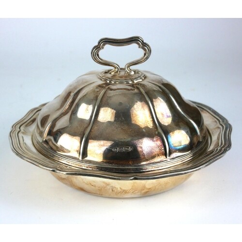 A VICTORIAN SILVER MUFFIN DISH AND COVER Having a carry hand...