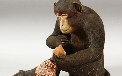 A WELL MODELLED JAPANESE POTTERY FIGURE OF A SEATED