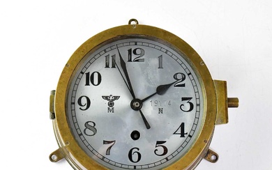 A WWII German Kriegsmarine U-Boat brass cased bulkhead clock, the...