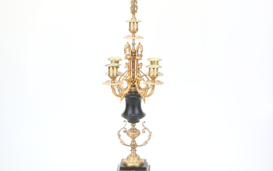 A candelabra, gilt/metal/marble and black stone.
