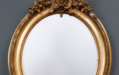 A decorative gilt oval wall mirror