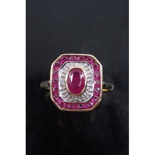 A diamond and ruby cluster ring, set in gold, showing as fi...