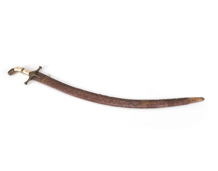 A fine Arabian Saif sword in its scabbard with a grip in...