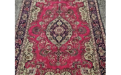 A fine hand woven Persian Tabriz Carpet with a multi coloure...
