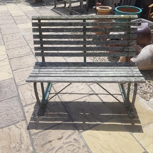 A garden bench, with cast metal ends.