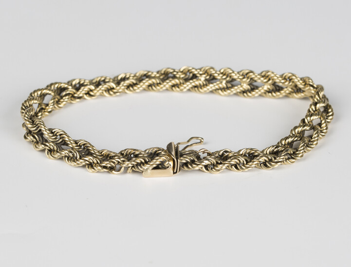 A gold bracelet in a ropetwist two row link design, on a snap clasp, detailed '14K', lengt